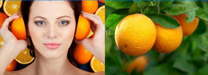 Kvinne holder appelsiner