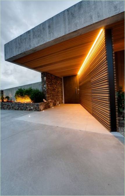 Hus blant åsene-landskapsprosjekt Okura Fra Bossley, New Zealand
